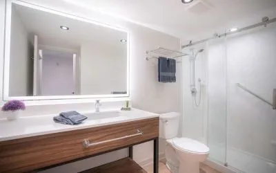 Guest bathroom with shower and free toiletries at Les Suites Hotel Ottawa.