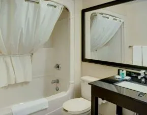 Guest bathroom with tub and free toiletries at Comfort Inn Edmonton West.