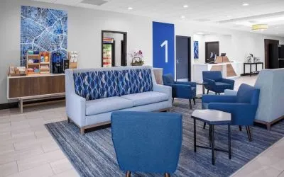 Lobby and coworking lounge at Holiday Inn Express & Suites Hermosa Beach.