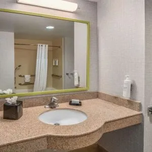 Guest bathroom with shower and tub at Hampton Inn & Suites Dallas/Allen.