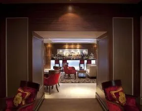 Hotel bar with lounge seating at The Royal Horseguards Hotel.