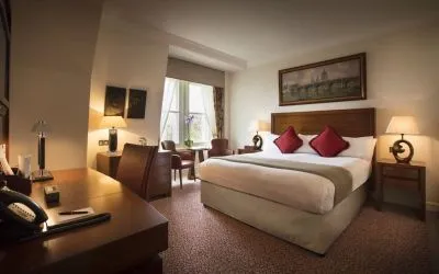 Day use room with work desk and lounge sitting at The Royal Horseguards Hotel.