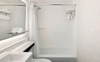 Guest bathroom with shower and tub at Holiday Inn Express New York City - Chelsea.