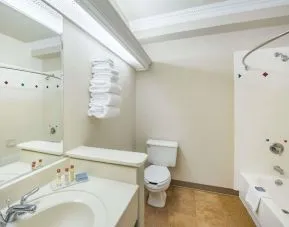 Guest bathroom with shower and tub at Hawthorn Suites By Wyndham El Paso Airport.