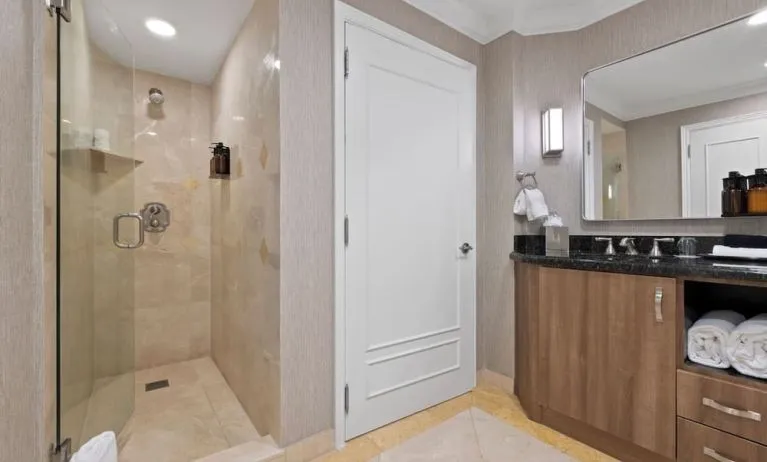 Guest bathroom with shower at The Atlantic Hotel & Spa.