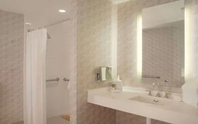 Guest bathroom with shower at Hyatt Regency Los Angeles International Airport.