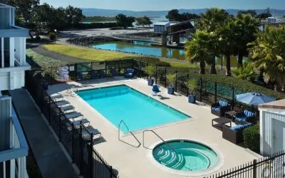 Refreshing outdoor pool and spa tub at The Marina Inn On San Francisco Bay.