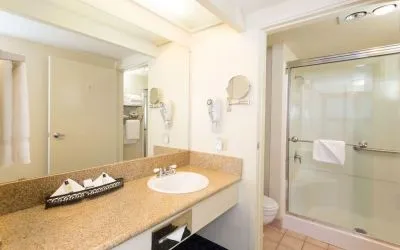 Guest bathroom with shower at The Marina Inn On San Francisco Bay.