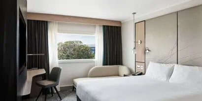 Day use room with work desk and sofa at Hyatt Place London Heathrow Airport.
