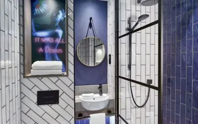 Guest bathroom with shower at NYX Hotel London Holborn By Leonardo.
