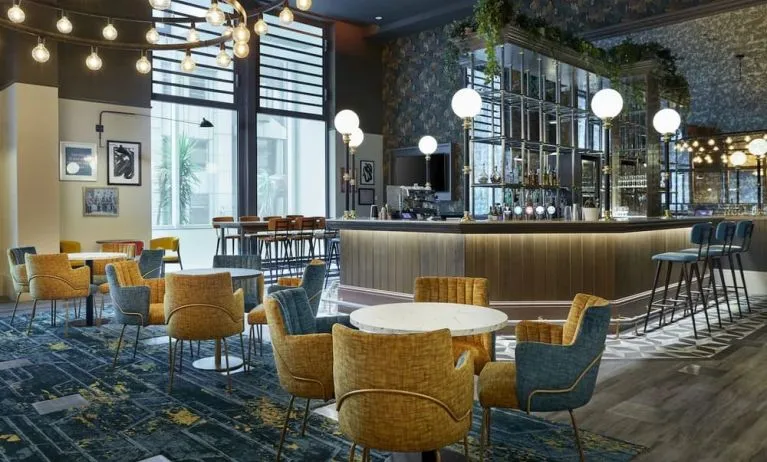 Hotel bar with comfortable seating, perfect for co-working at Leonardo Royal Hotel London Tower Bridge.