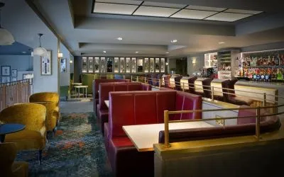 Hotel bar with comfortable seating, perfect for co-working at Leonardo Royal Hotel London City.