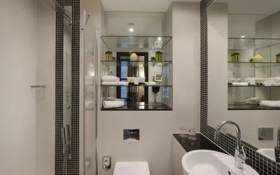 Guest bathroom with shower and free toiletries at Leonardo Royal St Paul's Hotel.