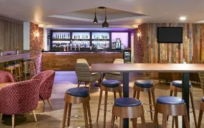 Hotel bar with lounge seating at Novotel Manchester West.