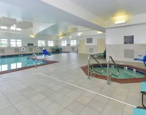 Indoor pool and spa tub at Residence Inn Champaign.