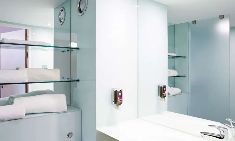 Guest bathroom with shower and free toiletries at Ibis Styles Barnsley.