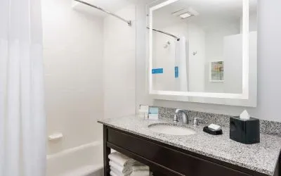 Guest bathroom with shower and tub at Hampton Inn Washington DC / White House.