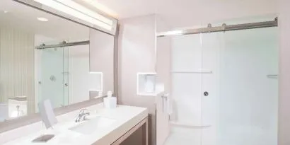 Guest bathroom with shower at Courtyard By Marriott Redwood City.