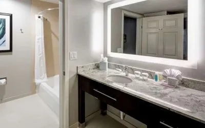 Guest bathroom with shower and tub at Homewood Suites By Hilton San Jose Airport-Silicon Valley.