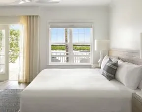 Romantic king room with natural light at Parrot Key Hotel & Villas.