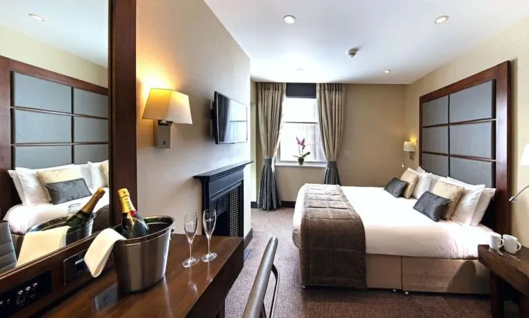 Day use queen room with work desk and fireplace at The Wellington by Blue Orchid Hotel (FKA The Rochester).