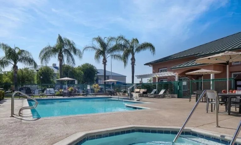 Refreshing outdoor pool and spa tub at Residence Inn Santa Clarita.