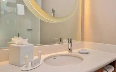 Guest bathroom with shower at SpringHill Suites By Marriott Irvine John Wayne Airport/Orange County.