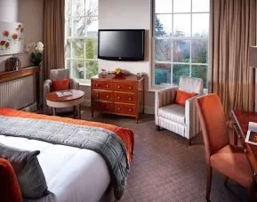 Day use king room with work desk and lounge seating at Alexander House Hotel And Utopia Spa Hotel.