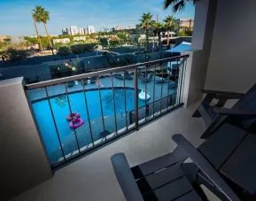 Balcony inside day use room with a view of the pool at Moxy Phoenix Tempe/ASU Area.