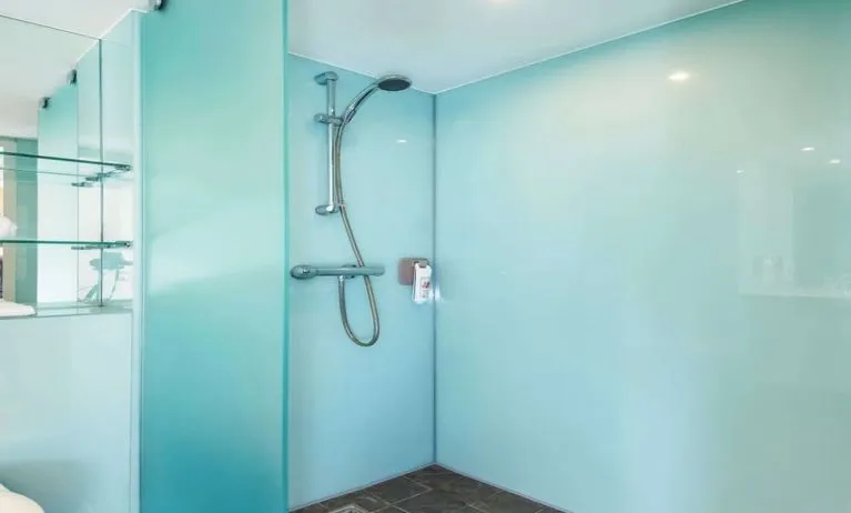 Guest bathroom with shower at Ibis Styles Haydock.