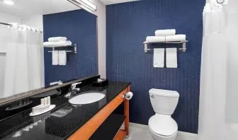 Guest bathroom with shower at Fairfield Inn By Marriott Denver Airport.