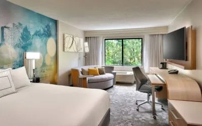 Day use room with sofa and work desk at Courtyard By Marriott Charlotte Airport/Billy Graham Parkway.