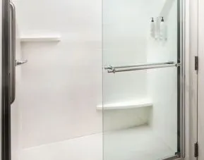 Guest bathroom with shower at Fairfield Inn & Suites By Marriott Jacksonville.