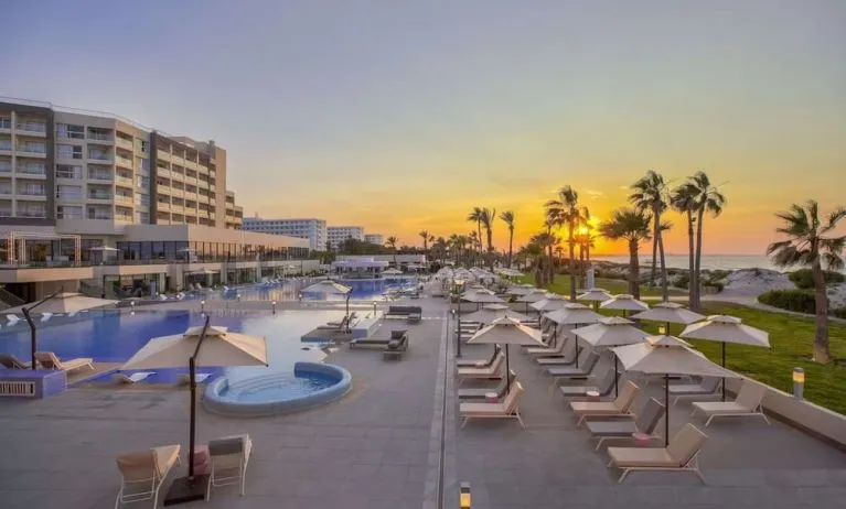 Pool at sunset at Hilton Skanes Monastir Beach Resort.