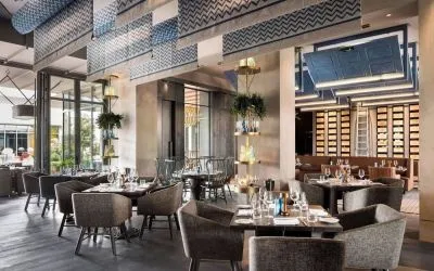 Dining area perfect for coworking at Hotel Nia, Autograph Collection.