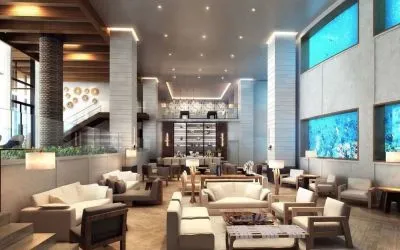 Lobby and coworking lounge beside the oceanarium at Alohilani Resort Waikiki Beach.