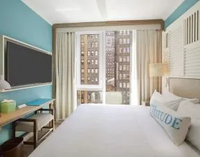 King room with TV at Margaritaville Resort Times Square.