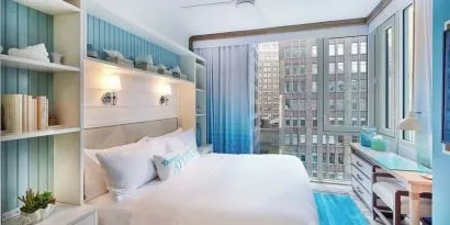 King bed with city views at Margaritaville Resort Times Square.
