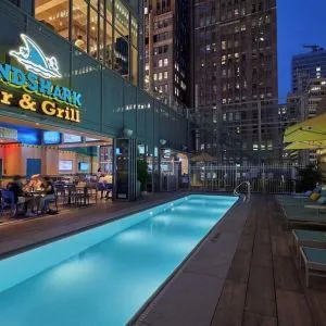 Outdoor pool at night at Margaritaville Resort Times Square.