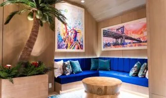 Coworking lobby seating at Margaritaville Resort Times Square.