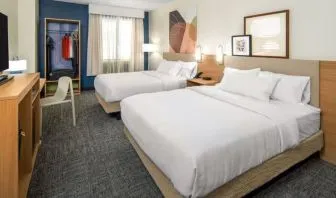 Day room with queen beds at Spark By Hilton Houston Hobby Airport.