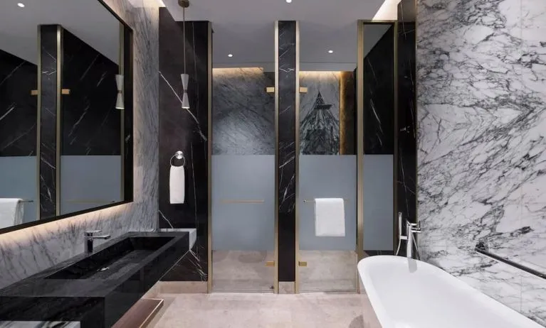 King room with bathroom at Velero Hotel Doha Lusail.