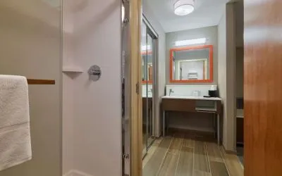 Guest bathroom with shower at Hampton Inn & Suites Providence/Smithfield.