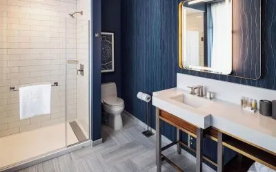 Private guest bathroom with shower at Rand Tower Hotel, Minneapolis, A Marriott Tribute Portfolio Hotel.
