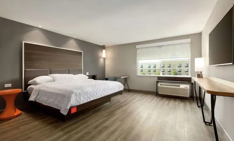 Spacious delux king bed with work desk at Tru By Hilton Wichita Northeast.
