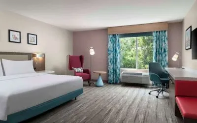 Bright and spacious day use room with work desk and lounge seating at Hilton Garden Inn Kennett Square.
