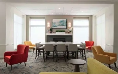 Lobby lounge with comfortable seating and workspace at Hilton Garden Inn Kennett Square.