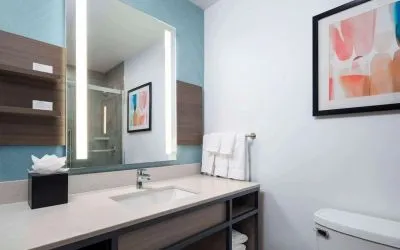 Private guest bathroom with shower and free toiletries at Hilton Garden Inn Kennett Square.