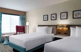 Day use twin room with lounge seating at Hilton Garden Inn Kennett Square.