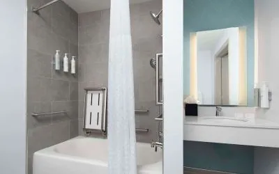 Private guest bathroom with convined tub and shower at Hilton Garden Inn Kennett Square.